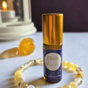 Coffret bien-être Lith’essentielle Sérénité avec bracelet en quartz hématoïde jaune et calcite jaune, élixir aux huiles essentielles de mandarine, petit grain mandarine et néroli pour apaiser le stress et cultiver la paix intérieure.